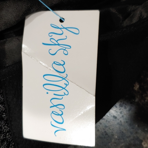 A Hippie Love LBD with cutouts and silver chain detail from Vanilla Sky Medium - Picture 9 of 11